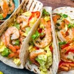 shrimps tacos with salsa vegetables and avocado