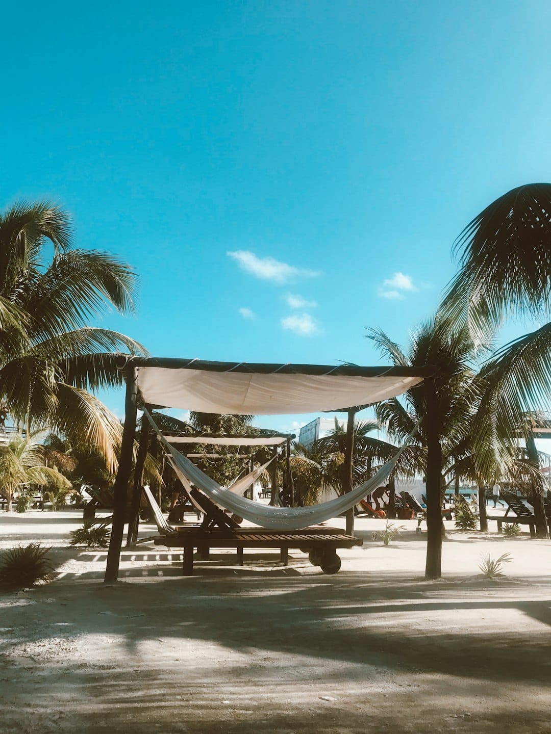 Photo by Nathan Shurr white hammock under canopy